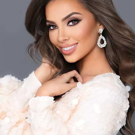 Juliette Valle, Miss Miami 2022, smiling in evening gown.